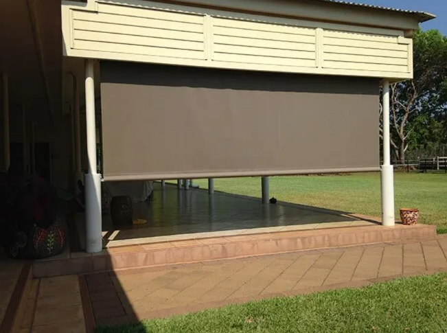 Outdoor Patio With a Large Lowered Beige Awning — NT Blinds in Yarrawonga, NT