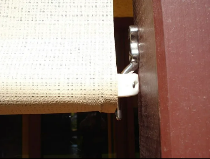Close-up of a White Roller Shade Mounted Beside — NT Blinds in Yarrawonga, NT