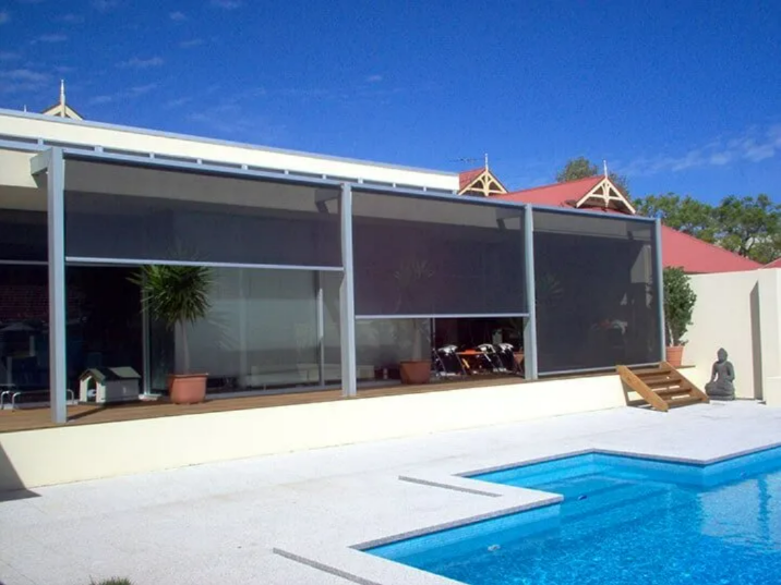 Modern House Patio With a Blue Swimming Pool — NT Blinds in Yarrawonga, NT
