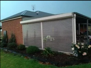Brick House With a White Louvered Patio Enclosure — NT Blinds in Yarrawonga, NT