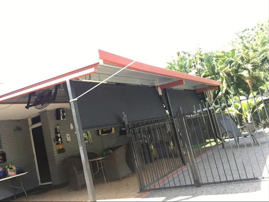 Small House With a Red Roof and Black Metal Gate — NT Blinds in Yarrawonga, NT