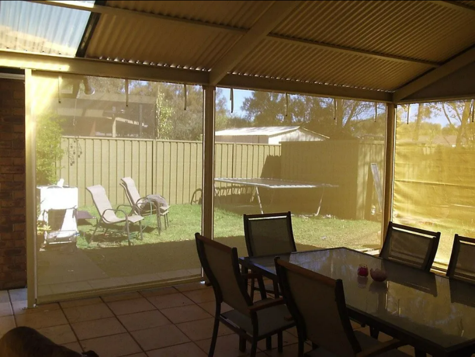 Patio With Screened Enclosure, Outdoor Dining Table — NT Blinds in Yarrawonga, NT