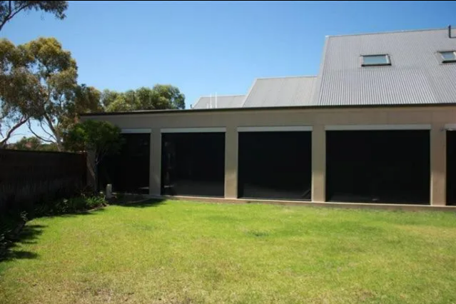Backyard With Green Lawn — NT Blinds in Yarrawonga, NT