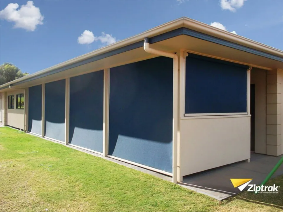 Blue Roller Shades on a Beige Patio — NT Blinds in Yarrawonga, NT