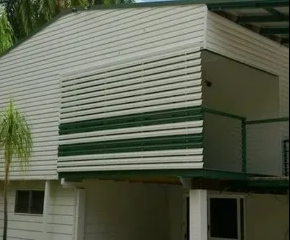 White House Exterior With Green-trimmed Balcony  — NT Blinds in Yarrawonga, NT