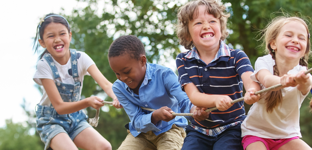 kids playing tug of war with rope