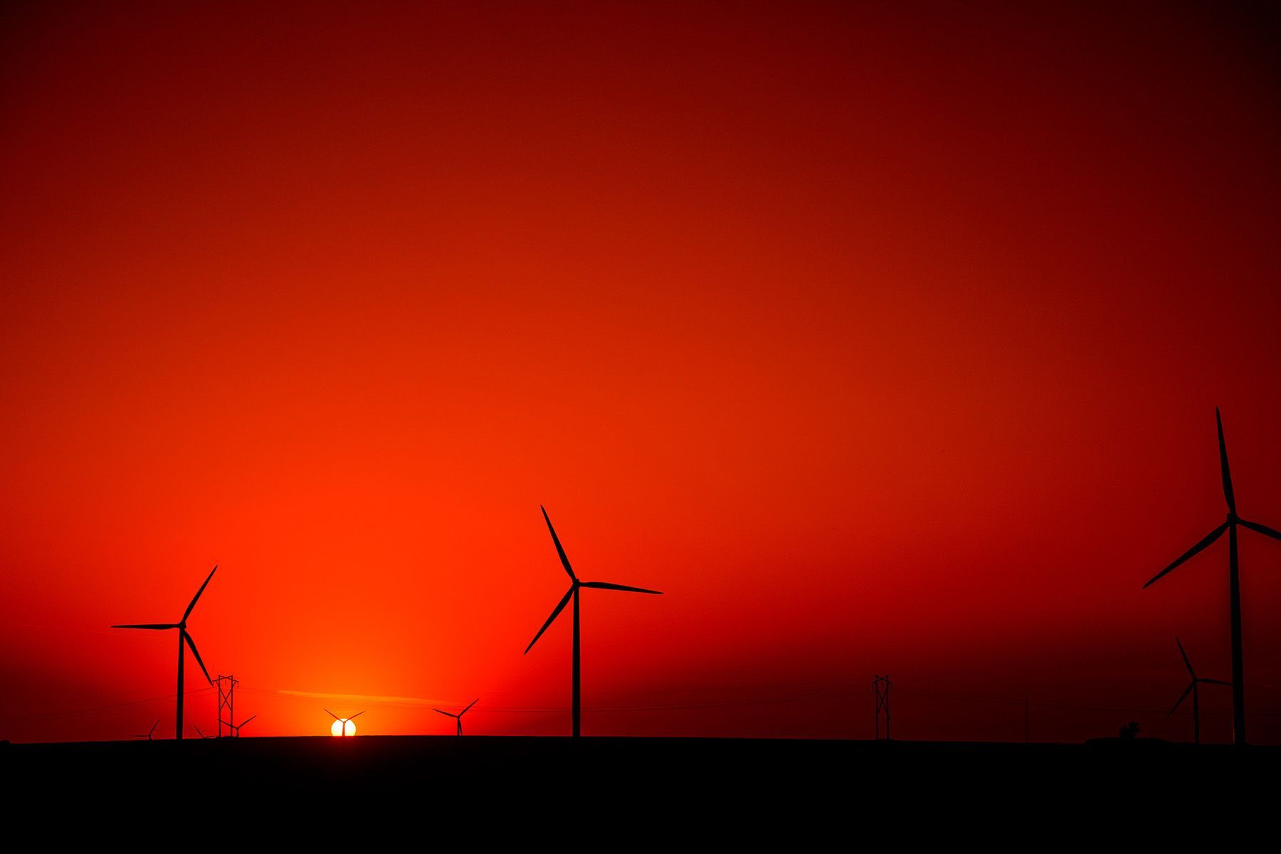 Sunset at the Elie, Manitoba Wind Farm by Doug Friesen