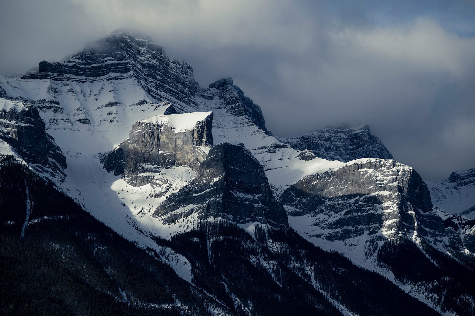 Beautifully soft light kisses these rugged peaks along Icefields Parkway in Alberta, Canada.