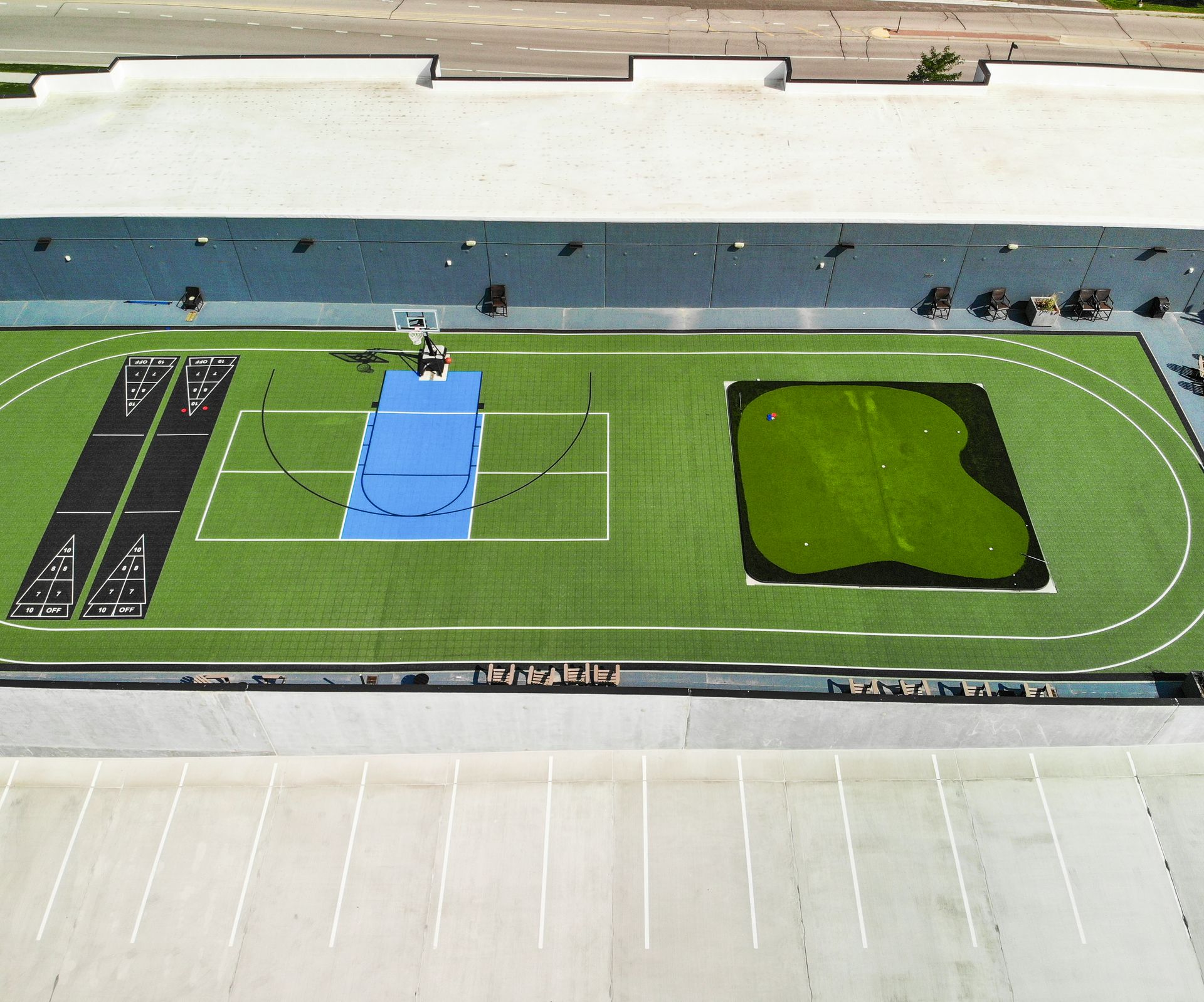 An aerial view of a basketball court in a parking lot