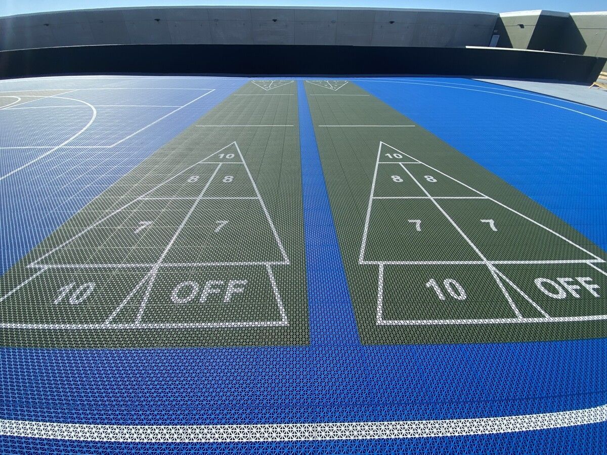 A shuffleboard court with the numbers 10 and 10 on it