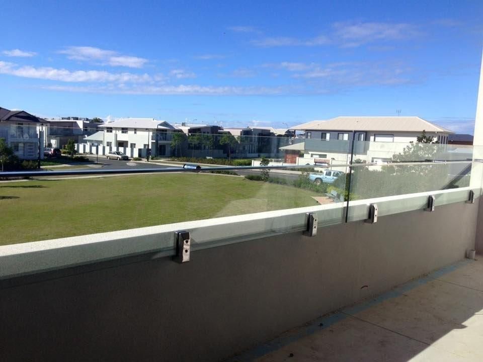 A Balcony With a View of a Residential Area — Frameless Shower Installations In Maroochydore, QLD 