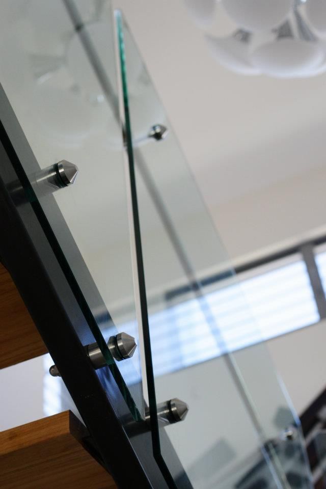 A Close Up of a Glass Railing on a Staircase — Frameless Shower Installations In Mooloolaba, QLD 