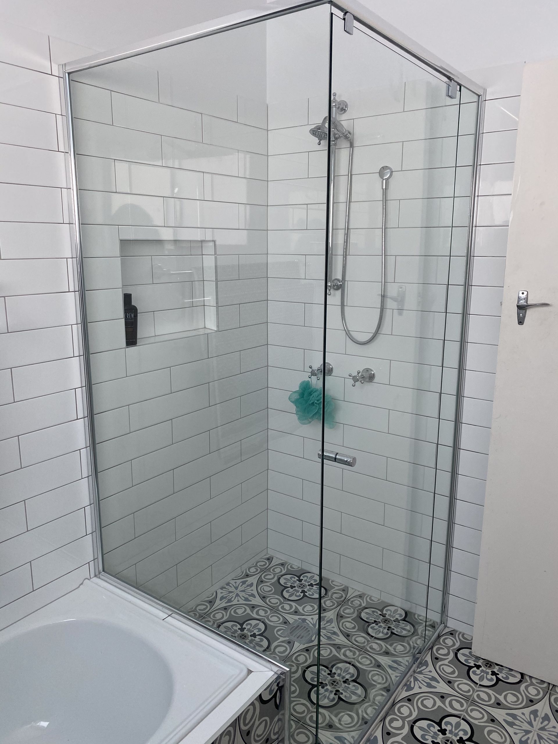 A Bathroom With A Shower Stall And A Window — Frameless Shower Installations In Maroochydore, QLD