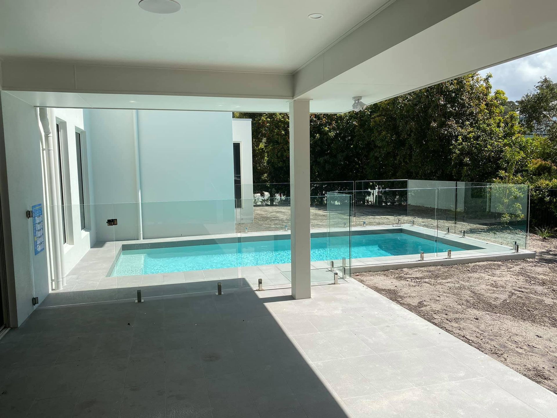 A Pool With Glass Fences