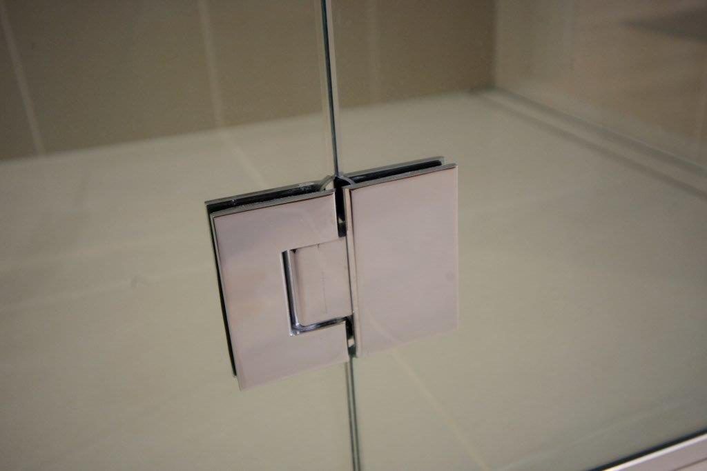 A Close Up Of A Shower Door With A Stainless Steel Hinge — Frameless Shower Installations In Maroochydore, QLD