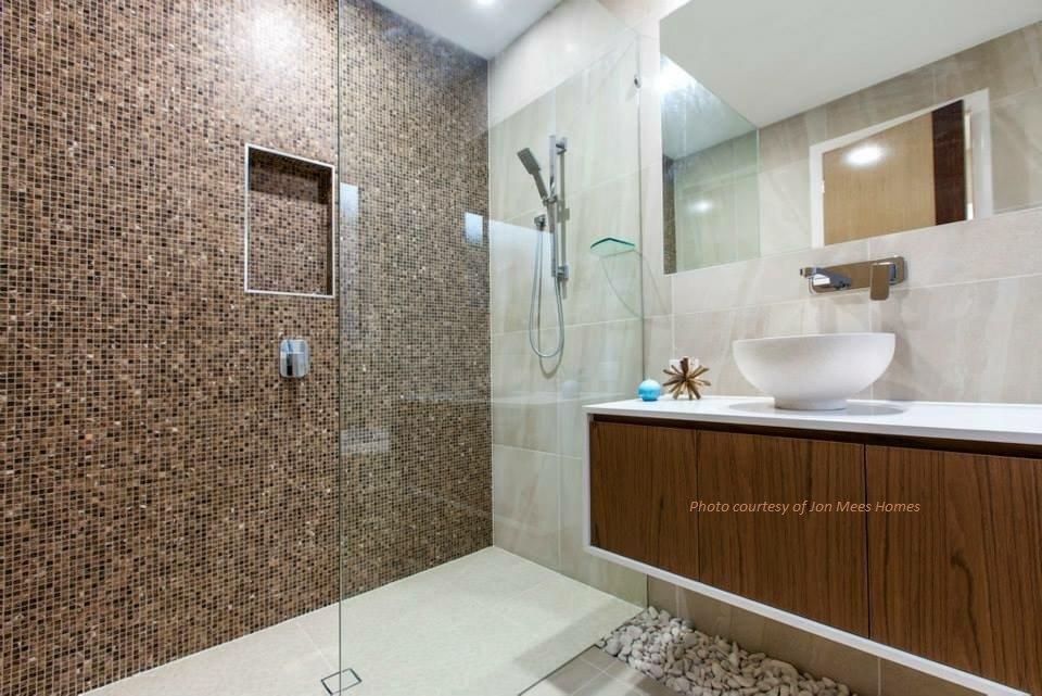 A Bathroom With A Walk In Shower And A Sink — Frameless Shower Installations In Maroochydore, QLD