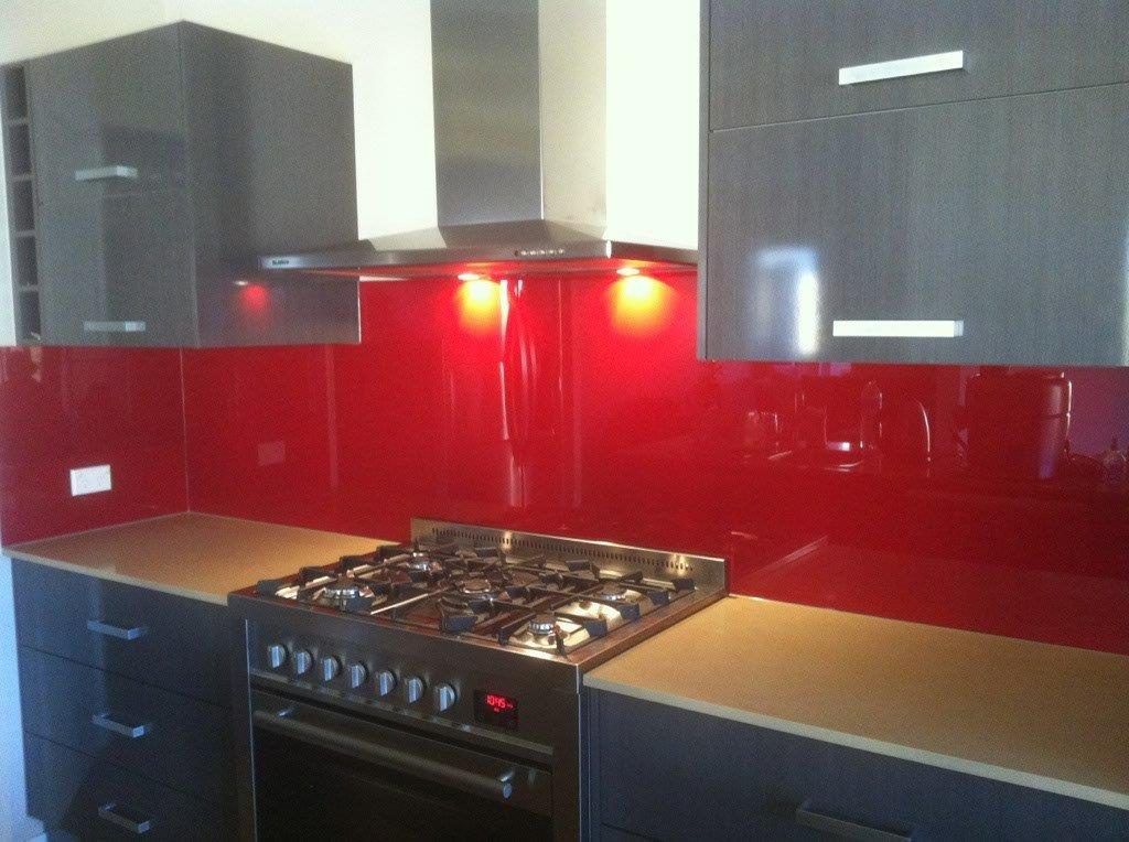 A Kitchen With Red Cabinets and a Stove Top Oven — Frameless Shower Installations In Maroochydore, QLD 