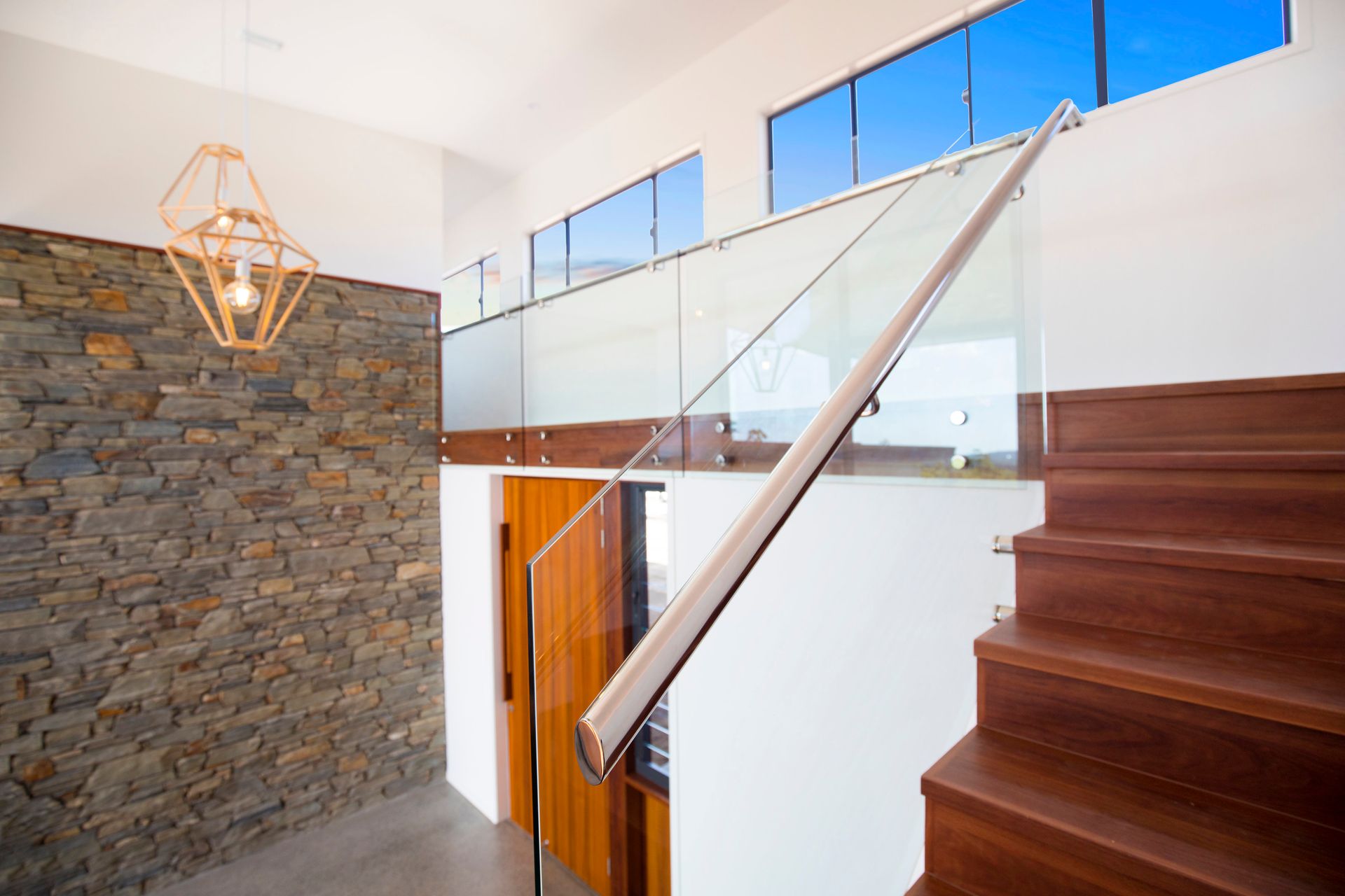 A Kitchen With Blue Counter Tops And White Cabinets — Frameless Shower Installations In Maroochydore, QLD