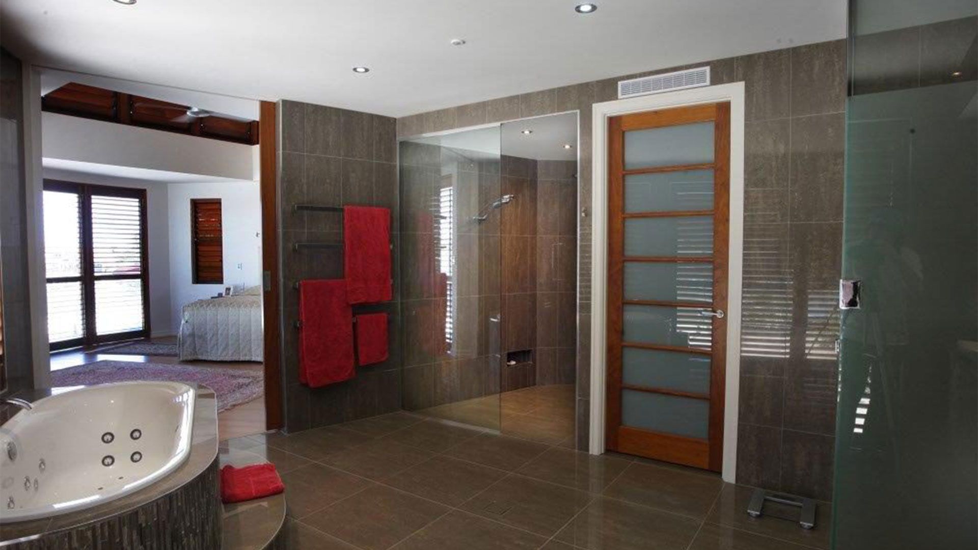 A Bathroom With Two Sinks And A Walk In Shower — Frameless Shower Installations In Maroochydore, QLD