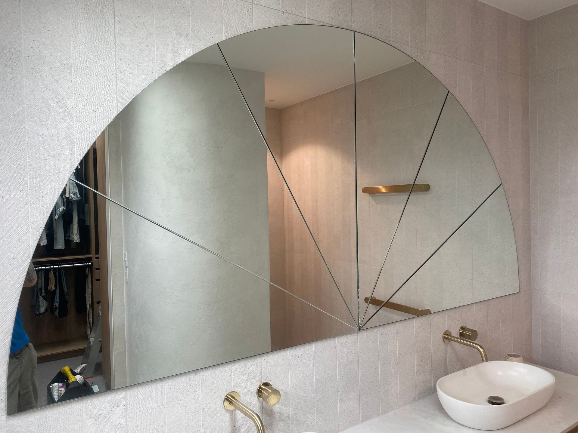 A Bathroom With A Sink And A Large Mirror — Frameless Shower Installations In Caloundra, QLD