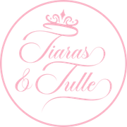 A pink circle with the words `` tiaras & tulle '' written on it.