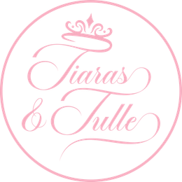 A pink circle with the words `` tiaras & tulle '' written on it.