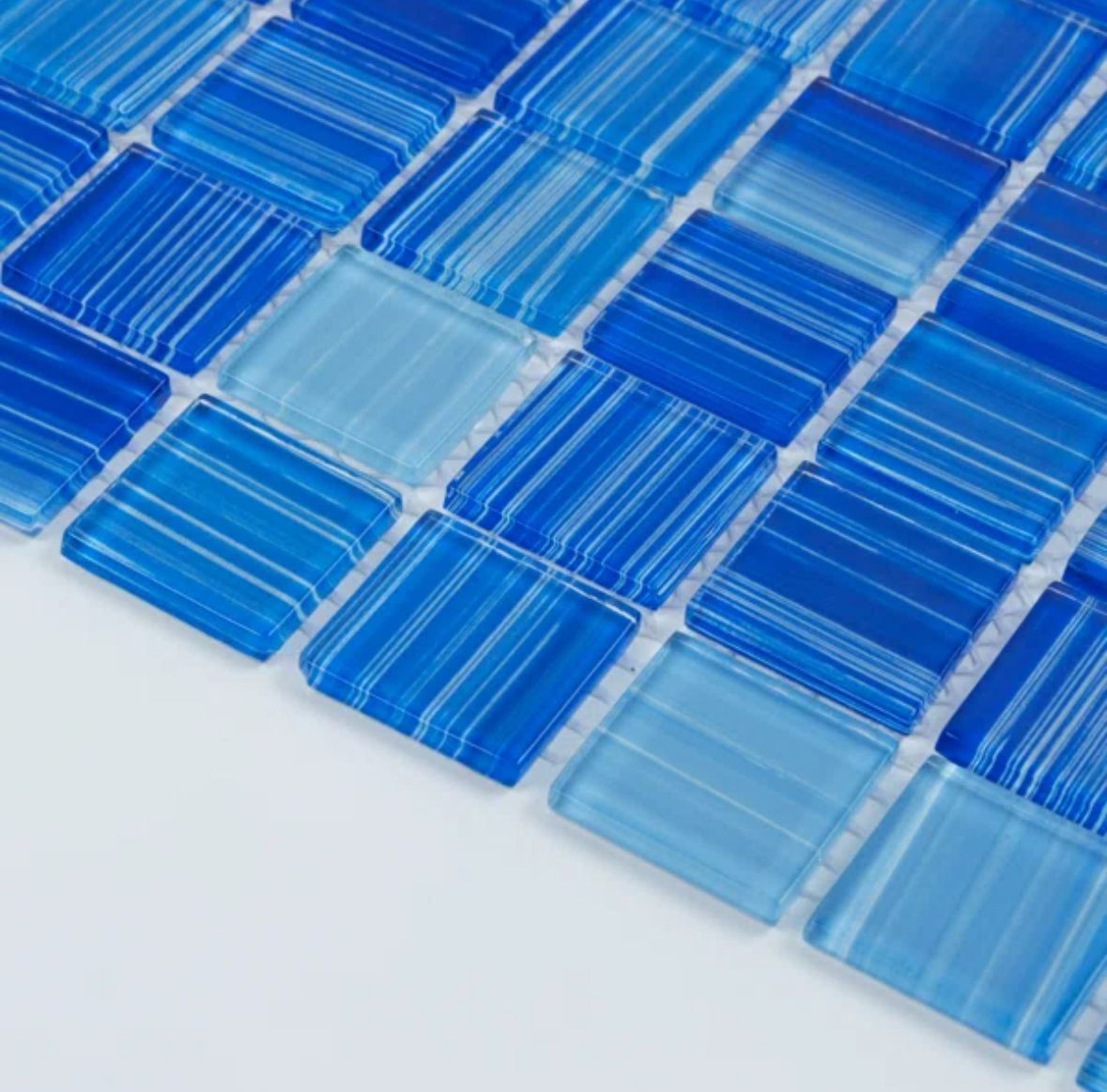 Blue glass mosaic tiles in varying shades.