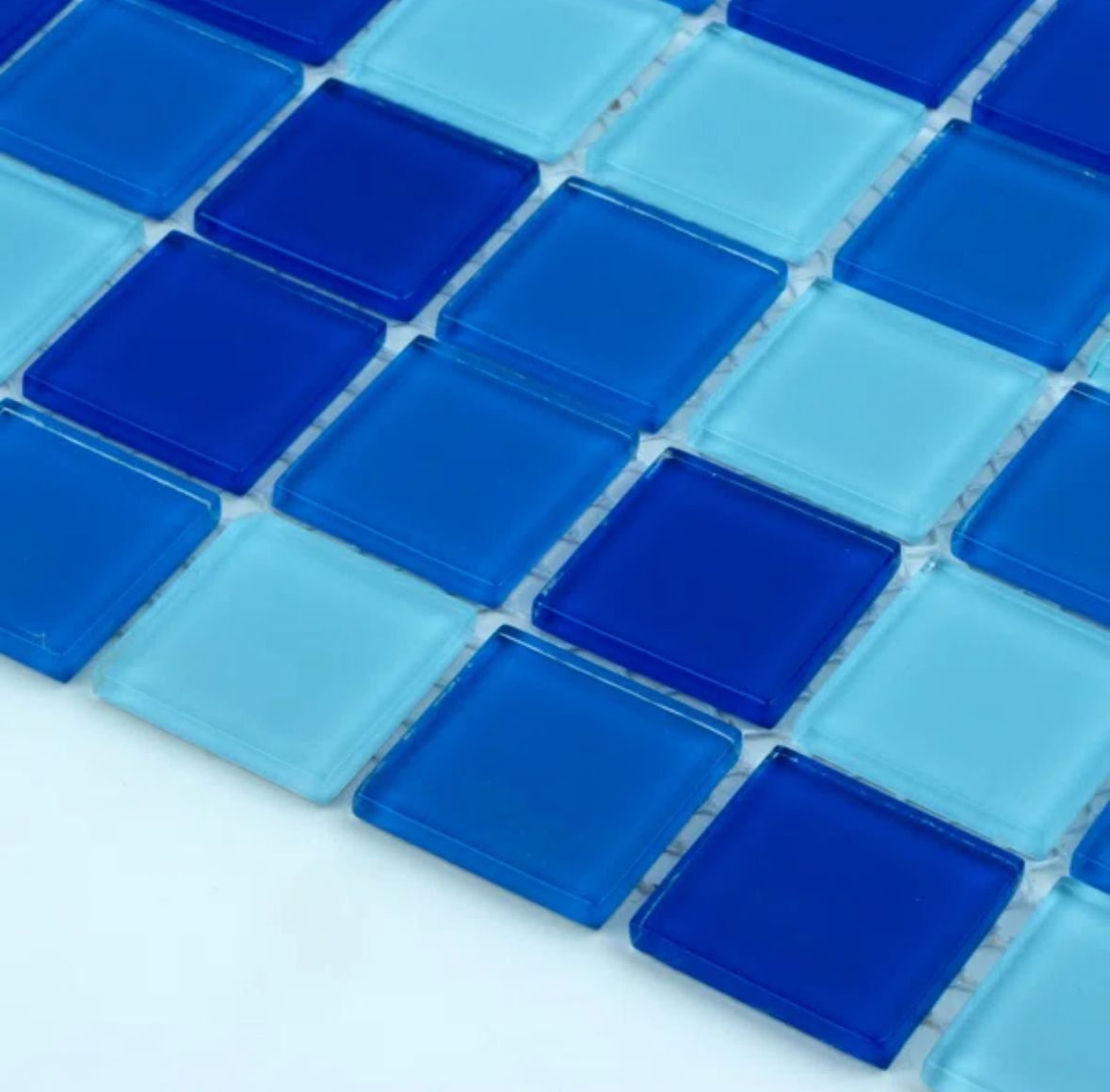 Blue and light blue square glass tiles arranged in a grid pattern.