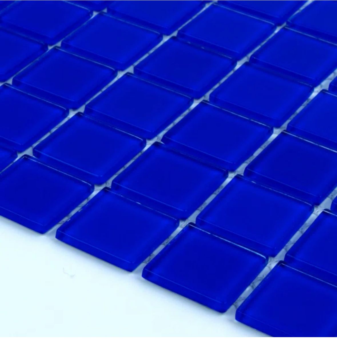 Blue square glass tiles arranged in a grid pattern.
