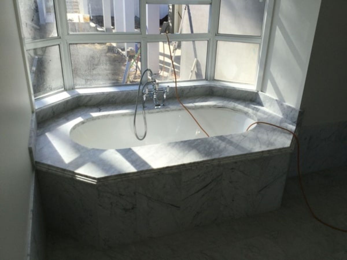 A Bathtub in A Bathroom Next to A Window — Sheridan Stone Aust in Ballina, NSW