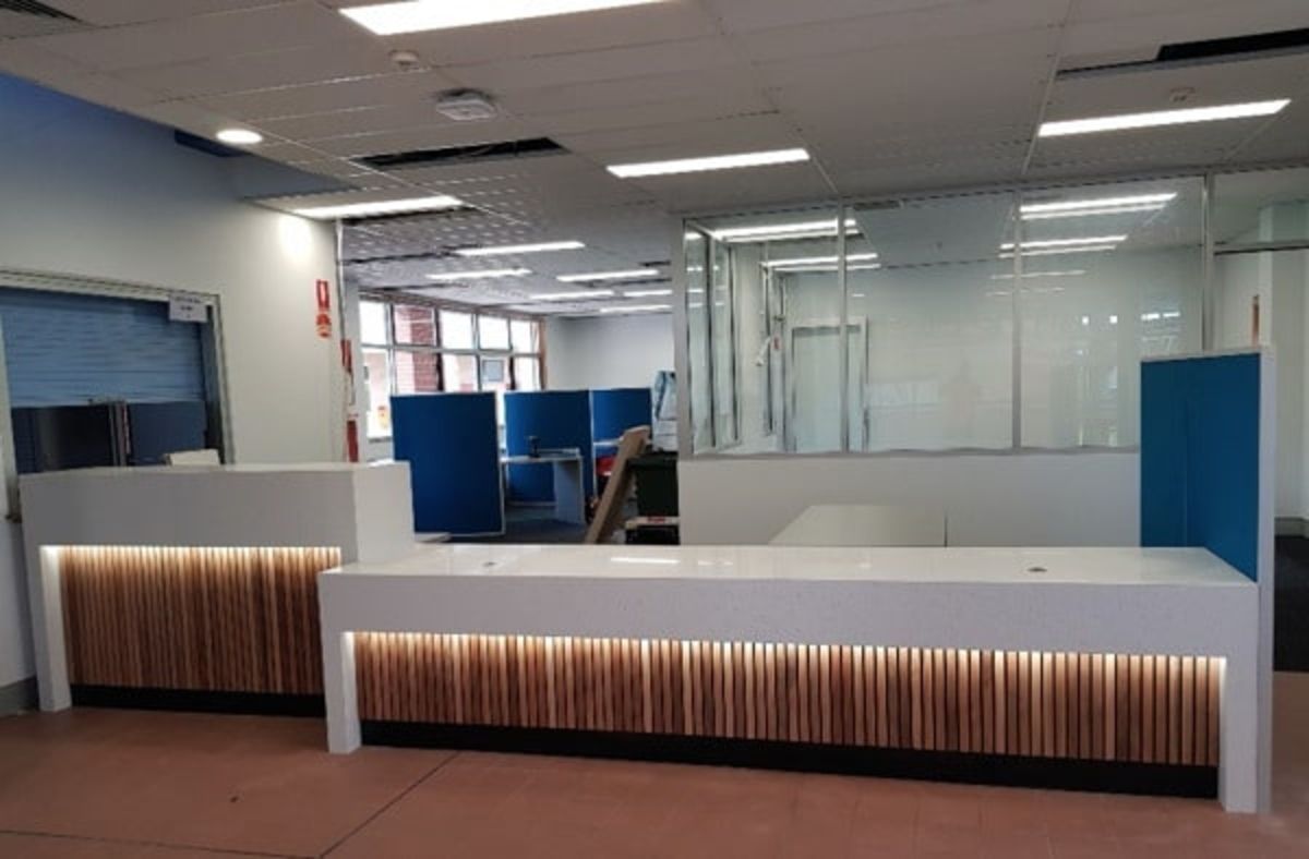 A Reception Desk in A Large Room with A Lot of Windows — Sheridan Stone Aust in Toormina, NSW