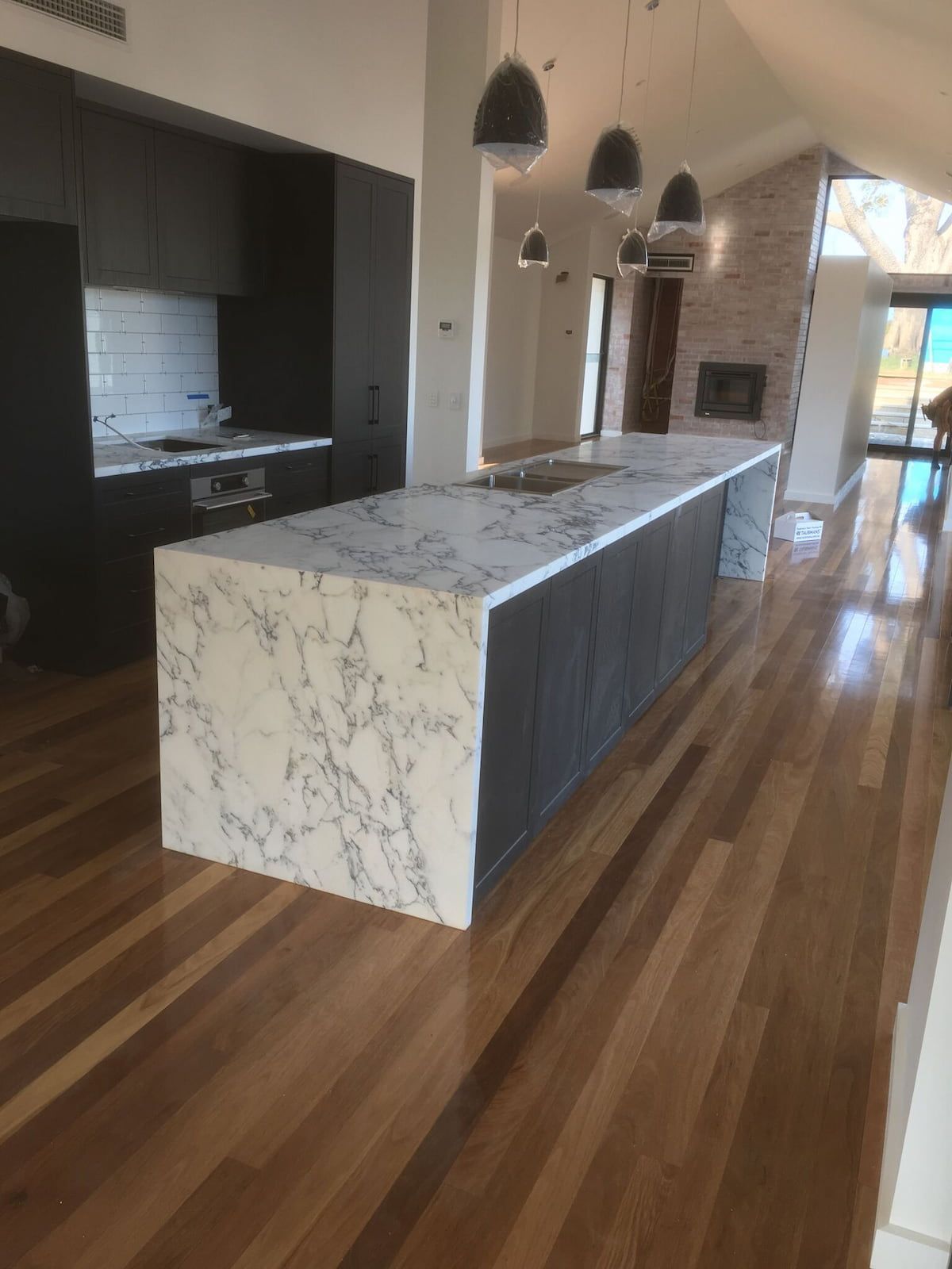 A Kitchen with Marble Counter Tops and Hardwood Floors — Sheridan Stone Aust in Port Macquarie, NSW