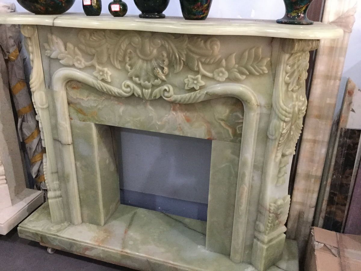 A Fireplace with Vases on Top of It in A Room — Sheridan Stone Aust in Kempsey, NSW