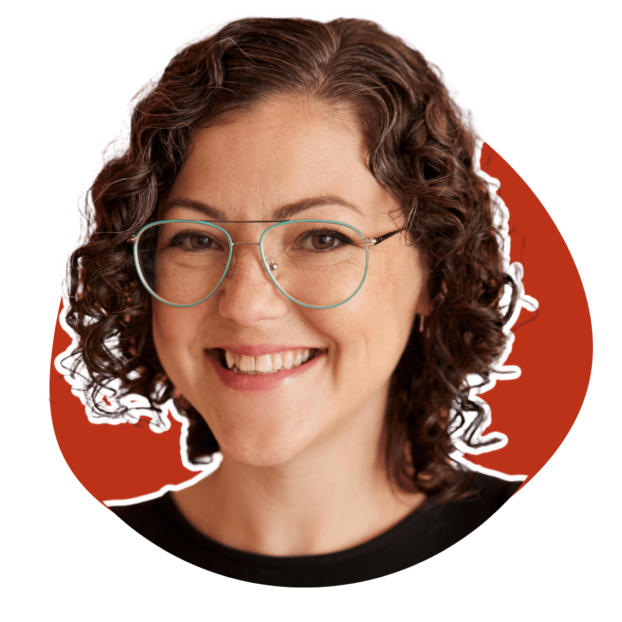 A woman with curly hair and glasses is smiling in a red circle.