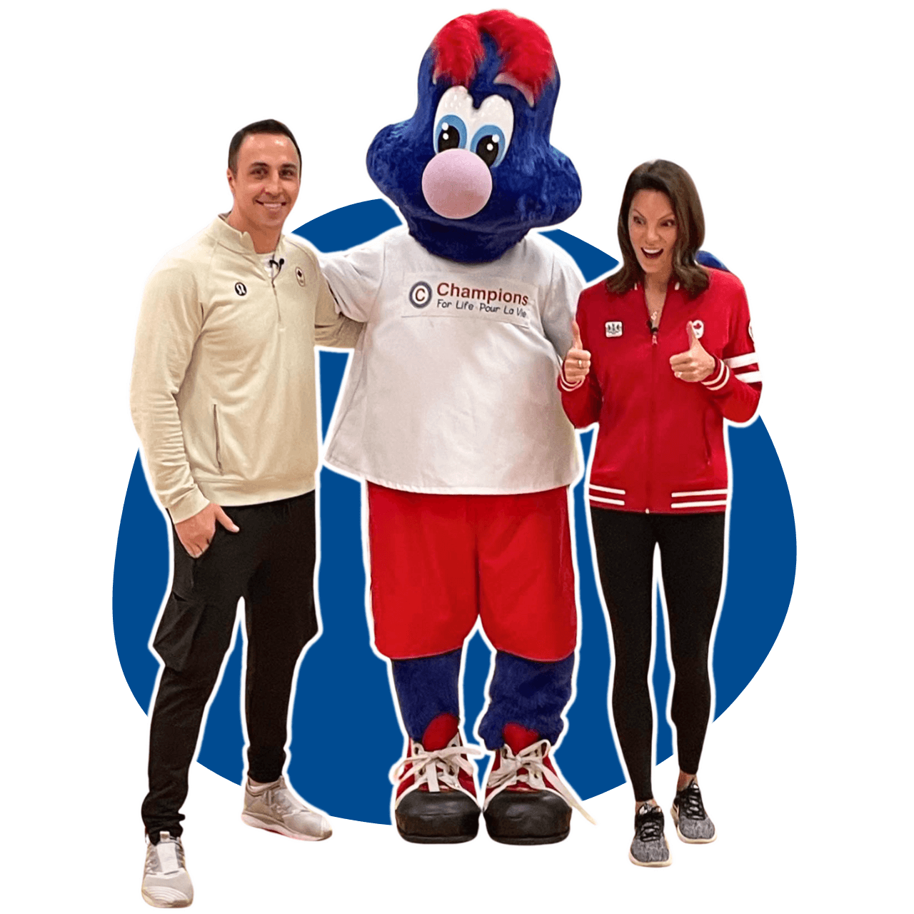 A man and a woman are standing next to a mascot wearing a t-shirt that says Champions for Life