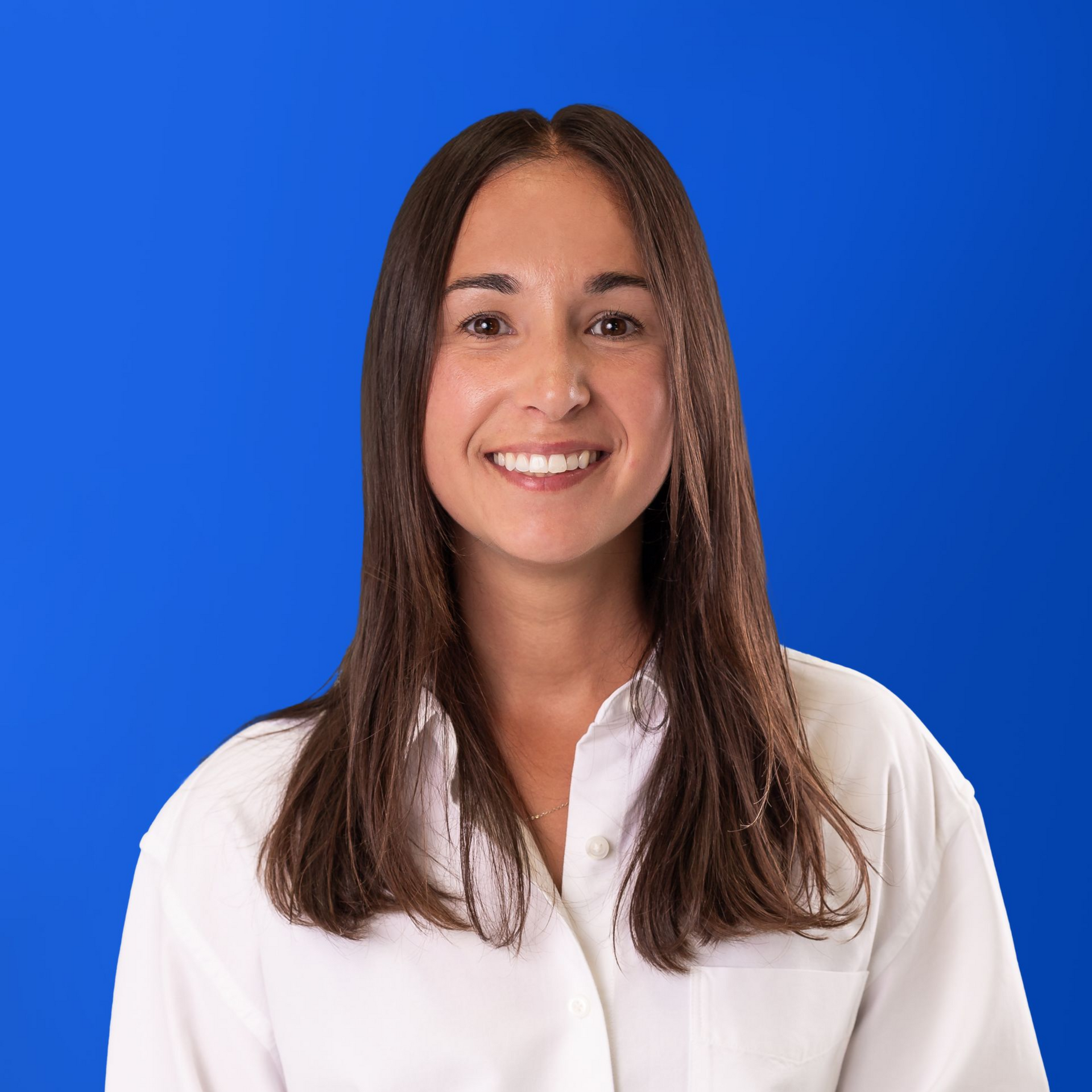 A woman with long hair is smiling in a yellow circle