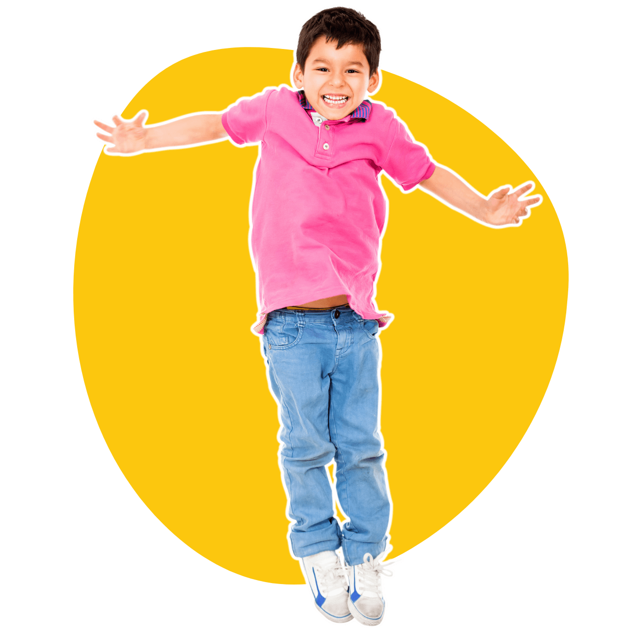 A young boy in a pink shirt and blue jeans is jumping in the air.