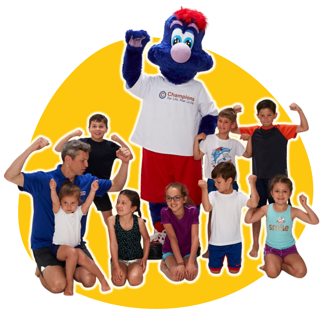 un groupe d' enfants se tient à côté d' une mascotte de champion pour la vie