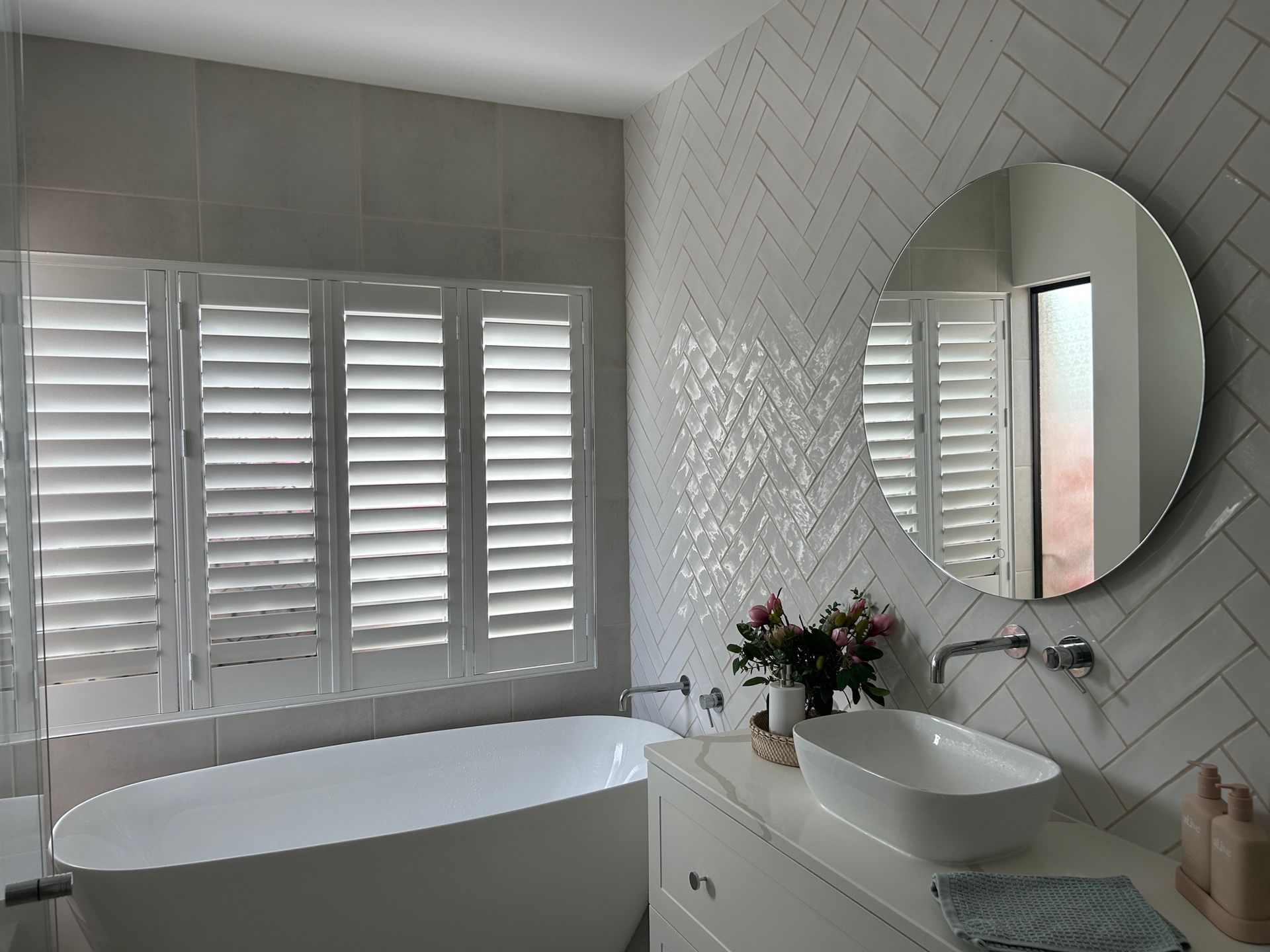 a building with a gray awning over the door and windows.