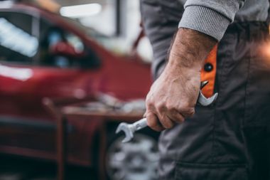 Mechanic Holding Wrench — Auto Service & Repair in Logan, OH