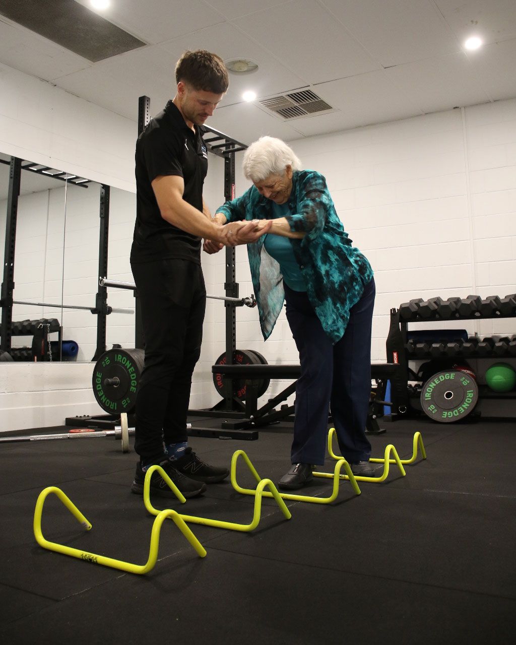 Elderly Woman Undergoing Physiotherapy Exercises in The Gym — Return to Performance Physiotherapy in Epsom, VIC