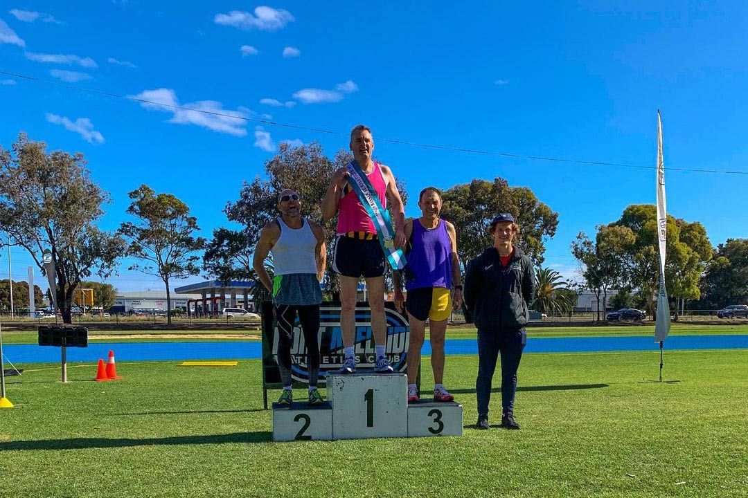 Group of People Are Standing on a Podium in a Field — Return to Performance Physiotherapy in Epsom, VIC
