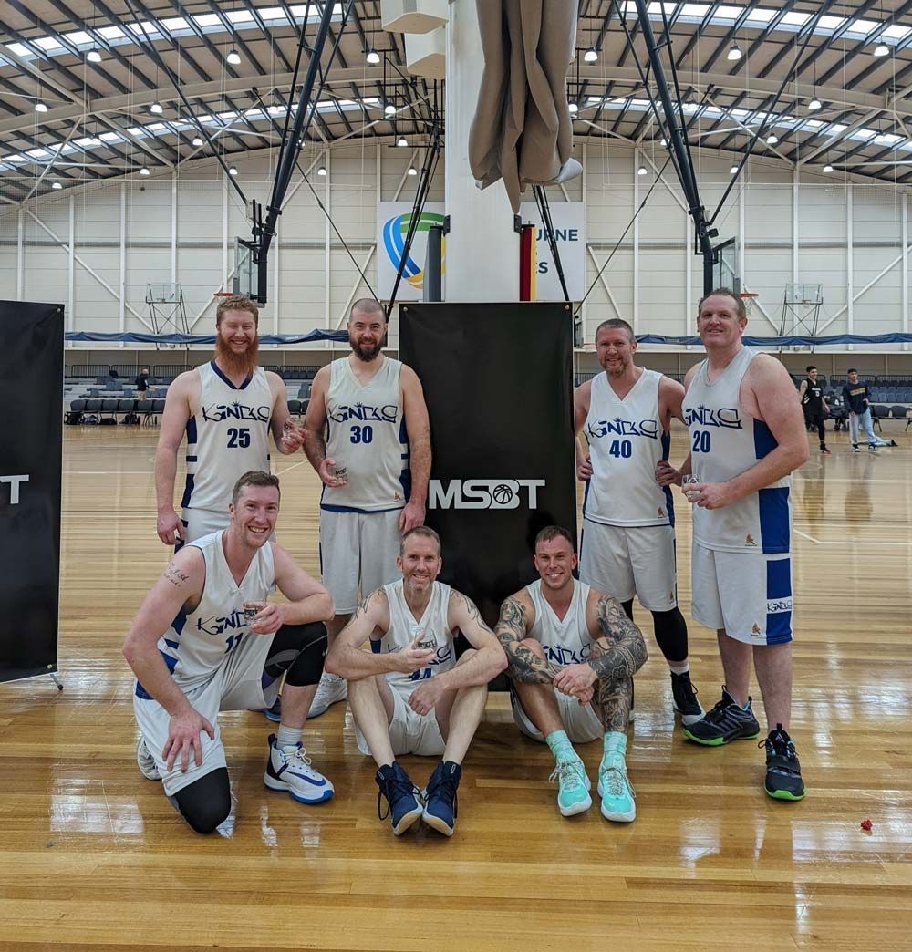 Group of Basketball Players Posing for a Picture — Return to Performance Physiotherapy in Epsom, VIC