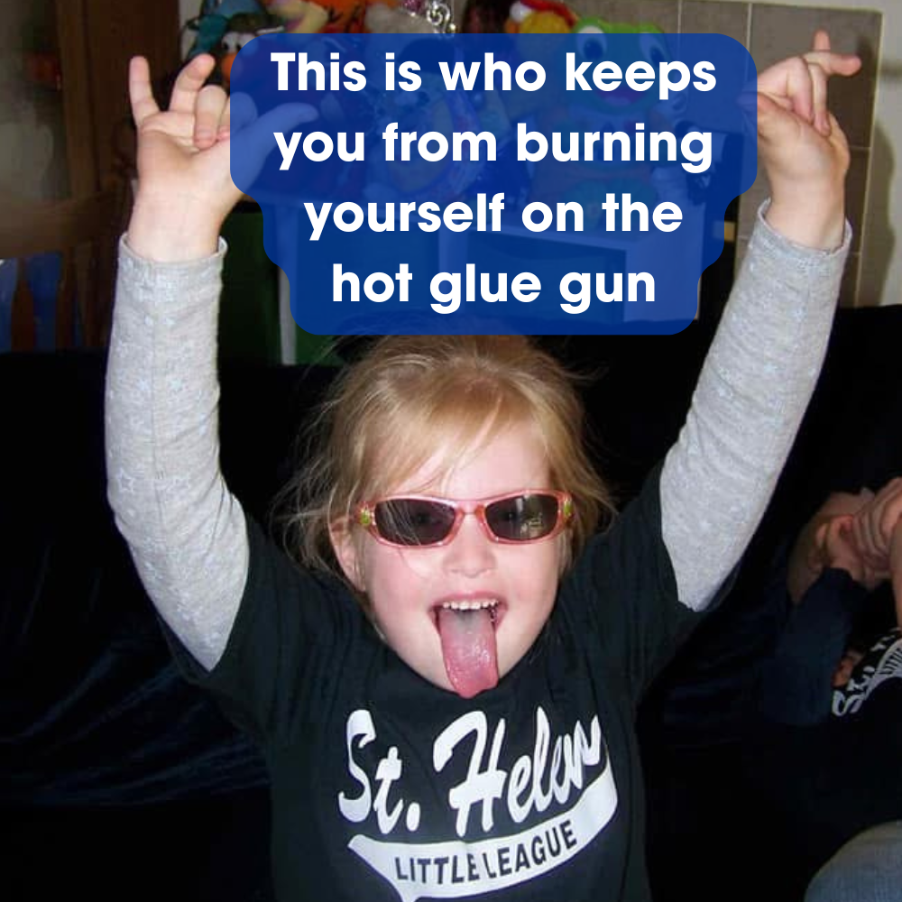 A person wearing sunglasses and a St. Helens shirt with arms raised and tongue out, with text overlay that says,