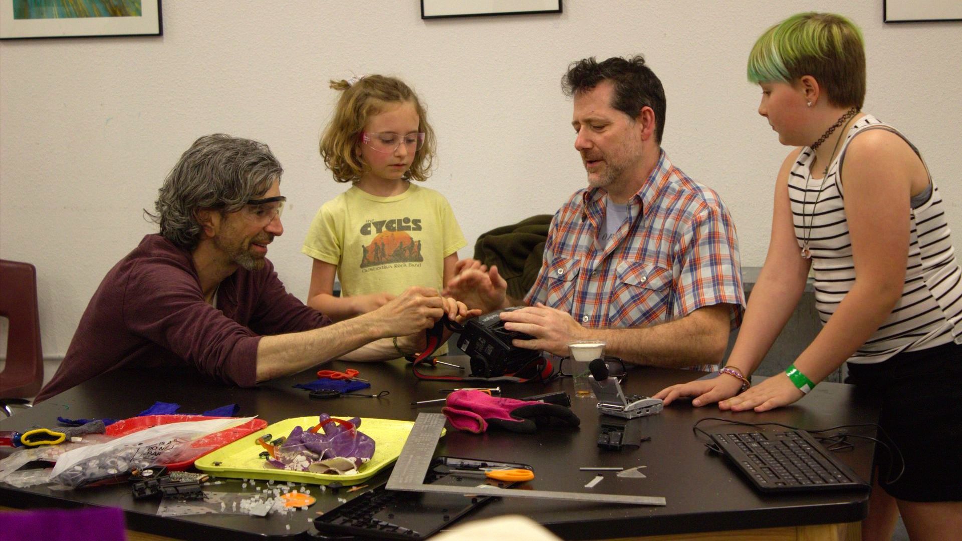 A family enjoys hands-on activities at a STEAM Social event at ScienceWorks