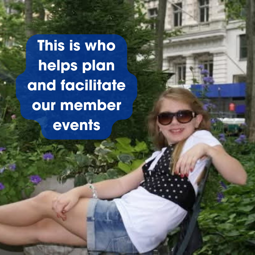 A young person wearing sunglasses and a black polka-dot top poses in an outdoor garden; text reads