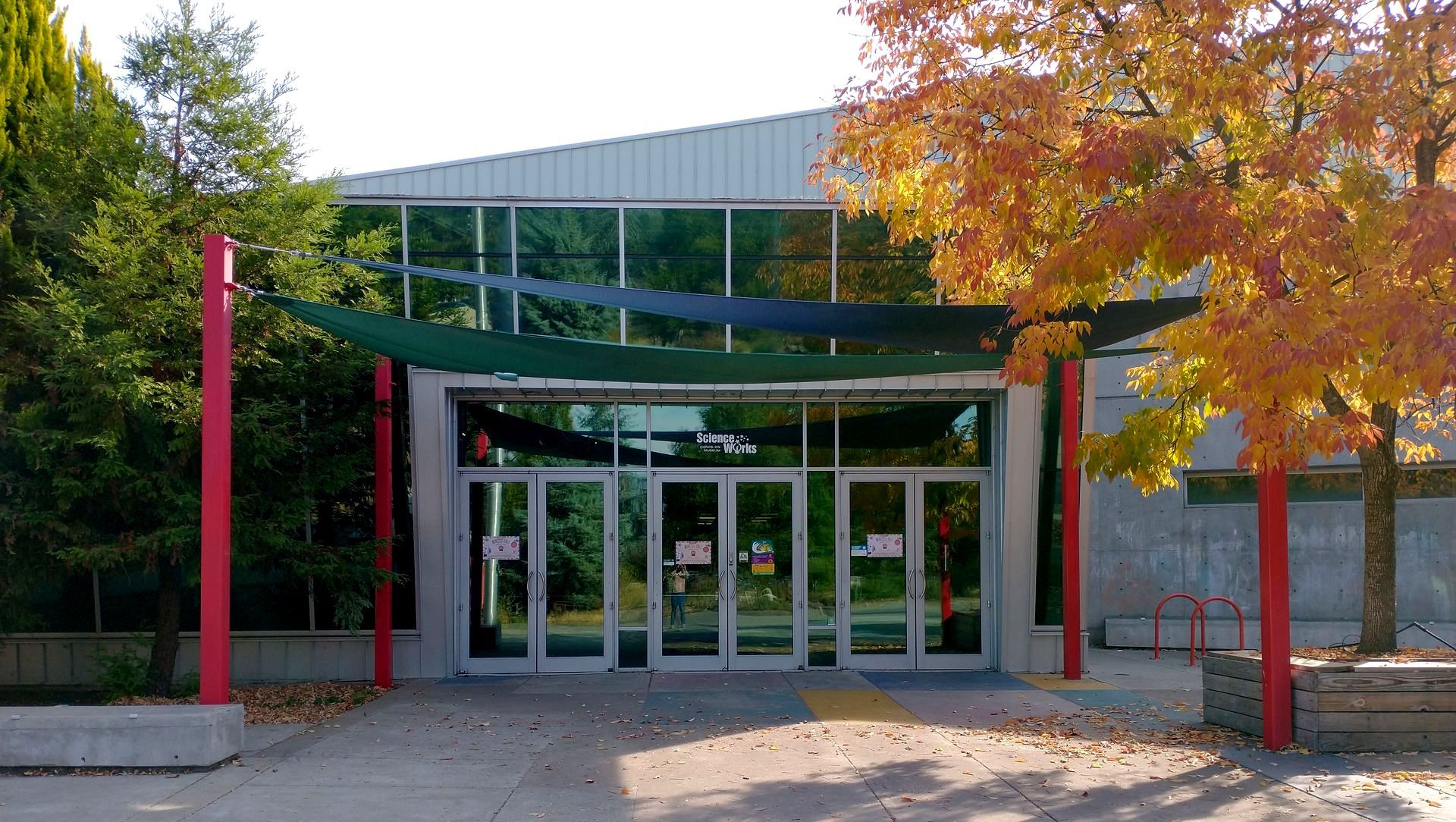 the front of ScienceWorks building featuring a tree during Autumn