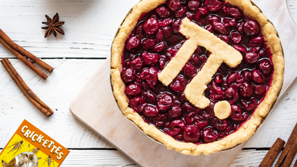 A freshly baked cherry pie with a pi symbol for the crust. 