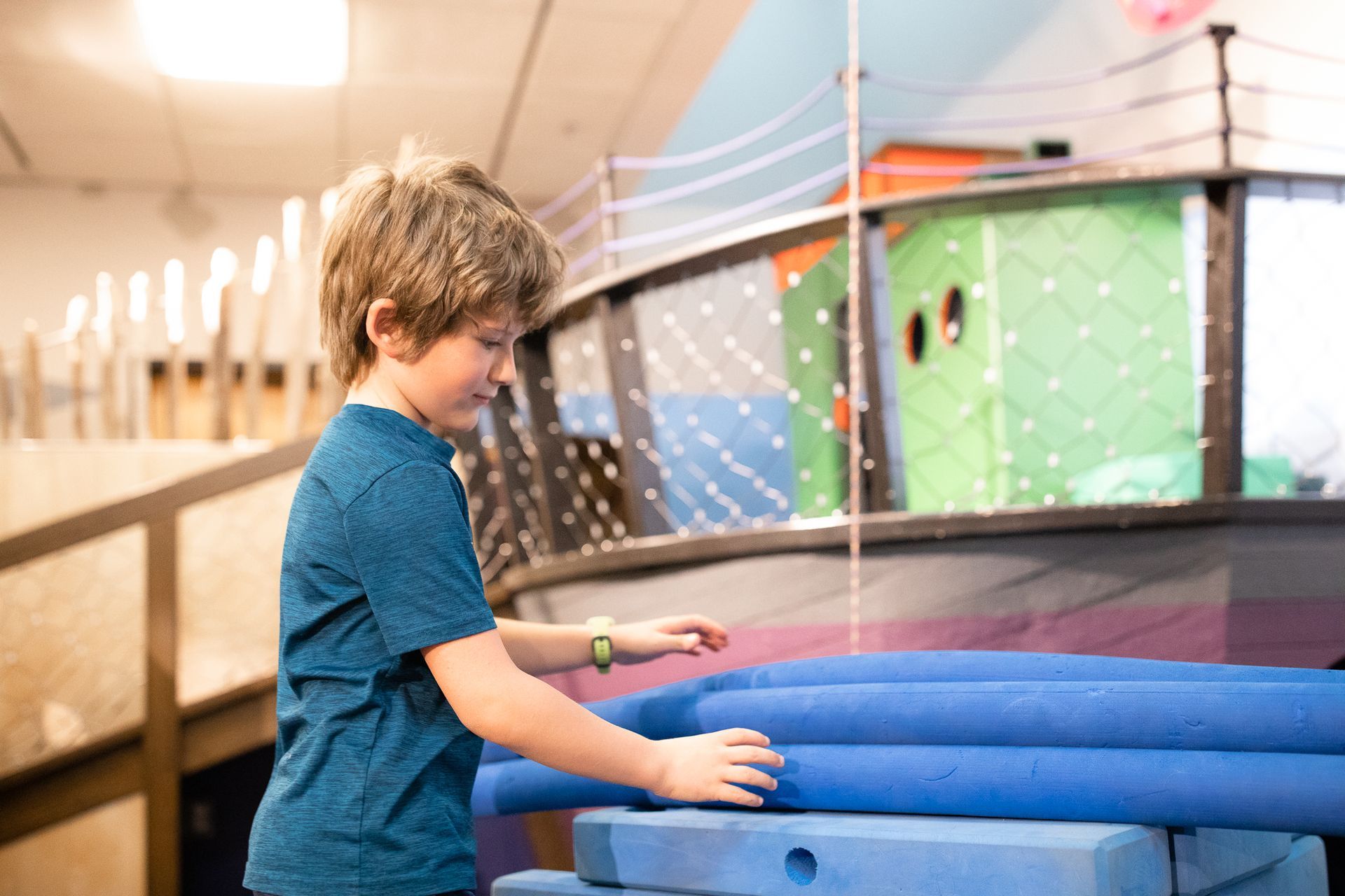 A boy plays in Pacific Crest Cove - a gentle play area at ScienceWorks Museum in Ashland Oregon
