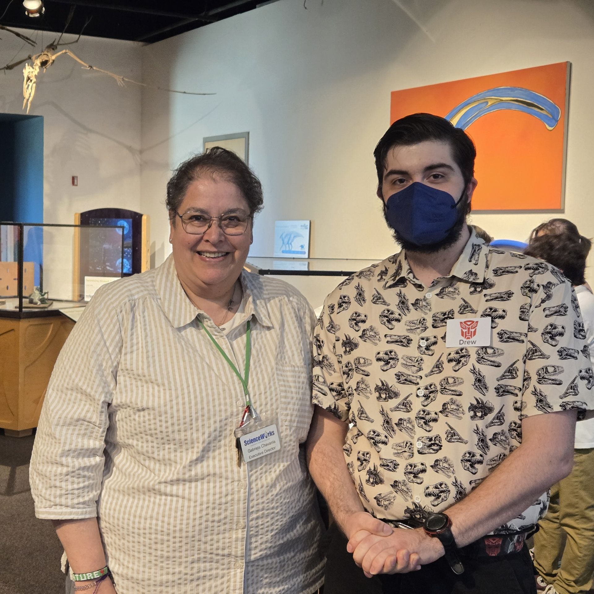 Executive Director Gabriela Chavarria (left), and artist Drew Hogan (right), at the opening reception of Paleoart Through Time.